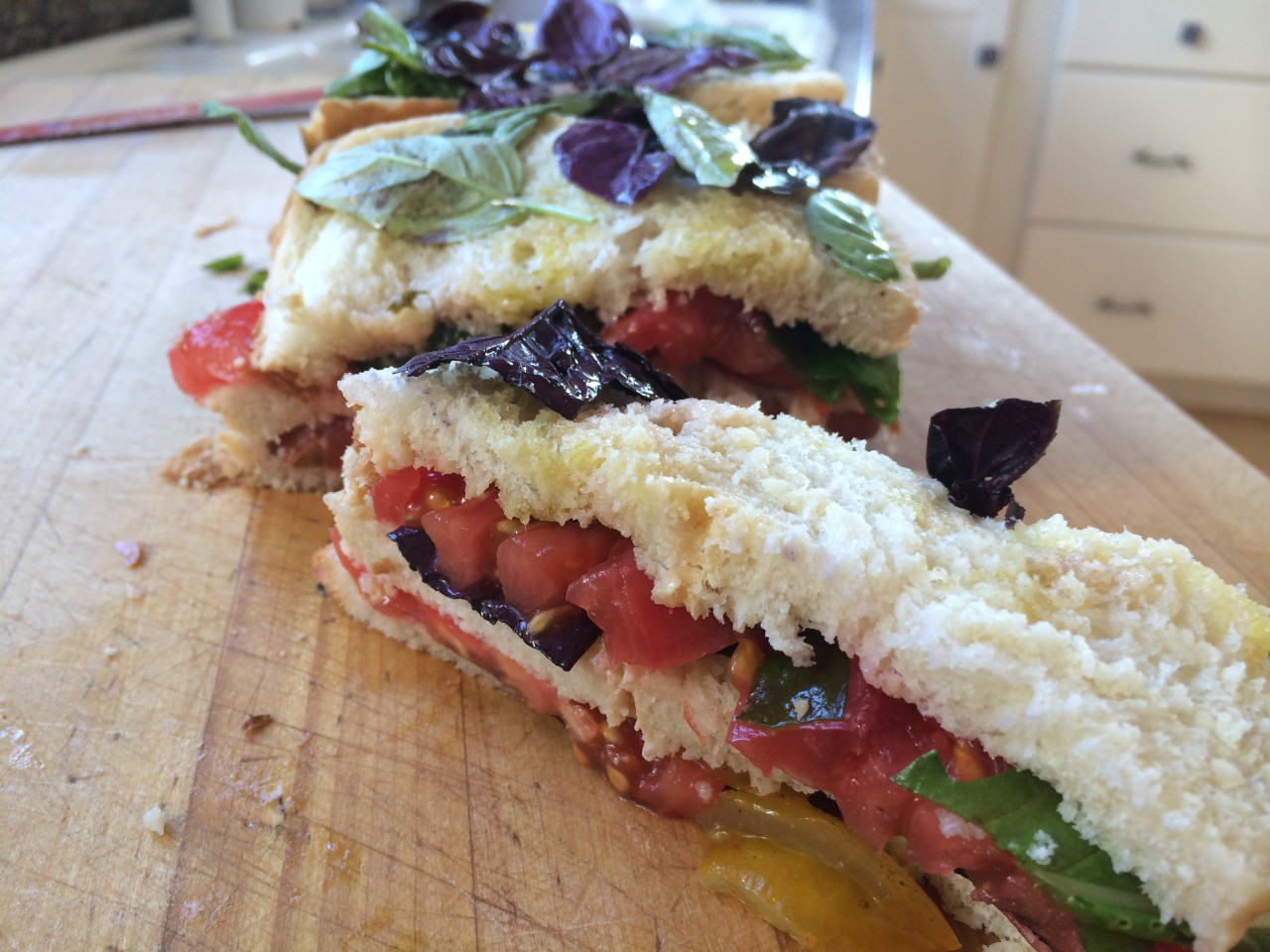 Mary Ann Esposito’s “Tomato Sandwich My Way” is made in a bread pan and serves eight people. (Kathy Gunst/Here & Now)