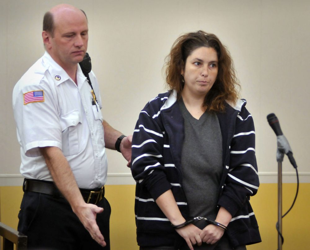 Erika Murray is escorted into a courtroom for her arraignment at Uxbridge District Court in Uxbridge on Sept. 12. (Paul Kapteyn/AP/Pool)