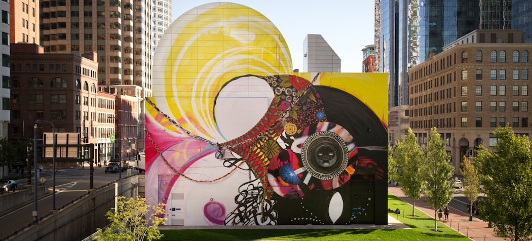 The Greenway Wall in Dewey Square has a new look -- a colorful mural called "Seven Moon Junction" created by artist Shinique Smith. (Geoff Hargadon via Rose Kennedy Greenway Conservancy)