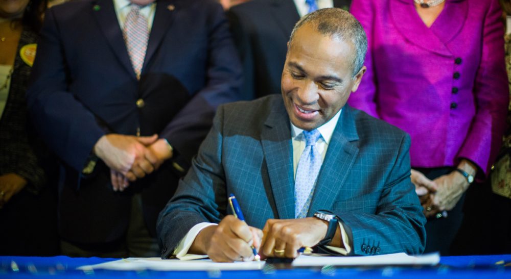 John Rosenthal: "Gun violence claims 88 lives a day in this country, including that of one child every three hours. While there are no fail safes, few states have been more proactive in trying to establish them." Pictured: Governor Deval Patrick signs H. 4376, An Act Relative to the Reduction of Gun Violence, into law on August 13, 2014. (massgovernor/Flickr)