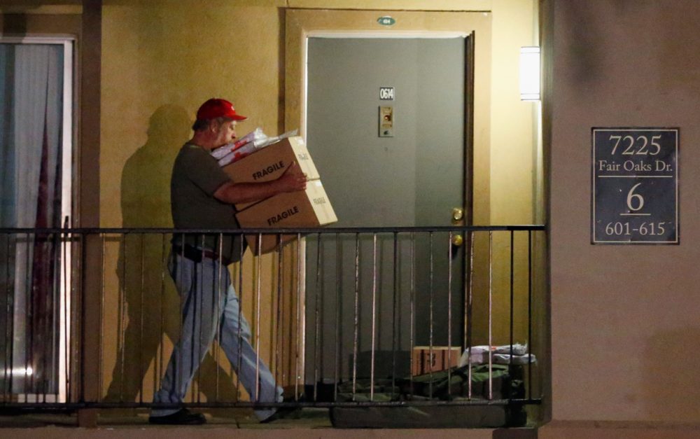Volunteers from the Red Cross deliver blankets and other supplies to a unit at the Ivy Apartments, where the confirmed Ebola virus patient was staying, on October 2, 2014 in Dallas, Texas. (Tom Pennington/Getty Images)