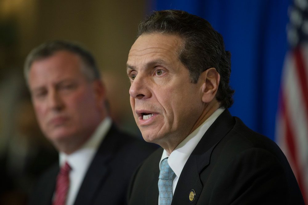New York Gov. Andrew Cuomo speaks during a news conference at Bellevue Hospital to discuss Craig Spencer, a Doctors Without Borders physician who tested positive for the Ebola virus last week in New York City. Along with New Jersey Gov. Chris Christie, Cuomo announced a mandatory Ebola quarantine for health workers returning from treating patients in West Africa. (John Minchillo/AP)