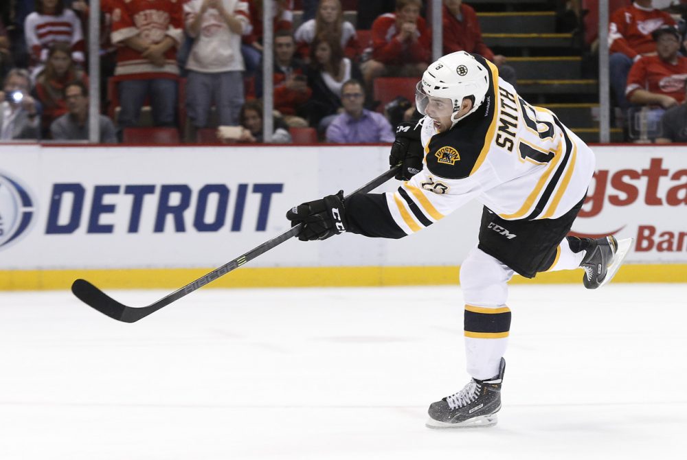 Boston Bruins right wing Reilly Smith (18) scores a goal in a shootout against the Detroit Red Wings Wednesday night in Detroit to win 3-2. (Paul Sancya/AP)