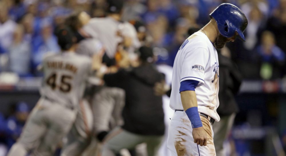 As another season draws to a close, we wake from "the best sort of late autumn dream." Pictured: Kansas City Royals' Alex Gordon walks off the field as San Francisco Giants players celebrates after Game 7 of baseball's World Series Wednesday, Oct. 29, 2014, in Kansas City, Mo. The Giants won 3-2 to win the series. (Charlie Neibergall/AP)
