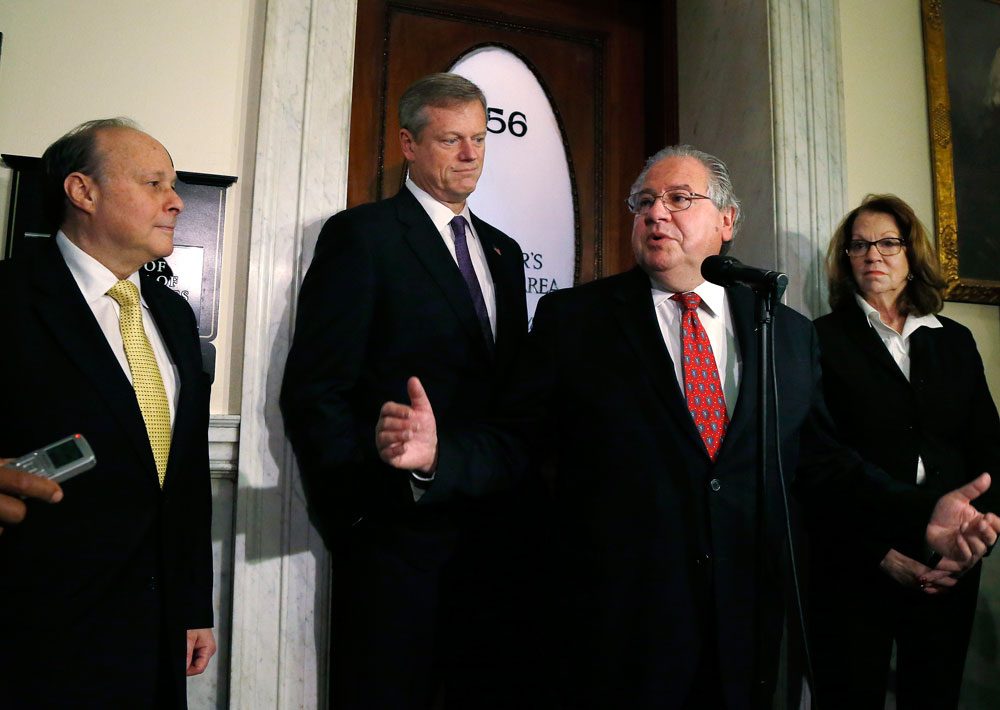 Gov.-elect Charlie Baker, second from left, listens during a State House news conference Monday with likely Senate President Stanley Rosenberg, left, House Speaker Robert DeLeo and current Senate President Therese Murray. (Elise Amendola/AP)