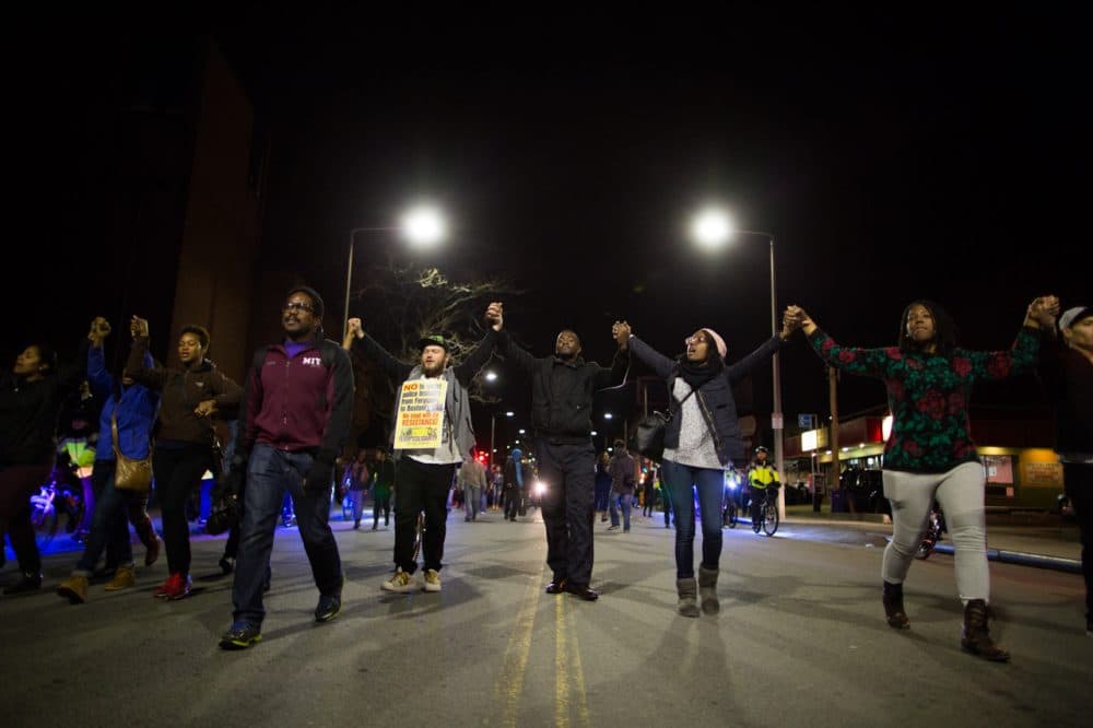 In Boston, hundreds of protesters marched through the city streets in solidarity with demonstrators in Ferguson in the aftermath of a grand jury’s decision to not indict a white officer who shot and killed an unarmed black teen.