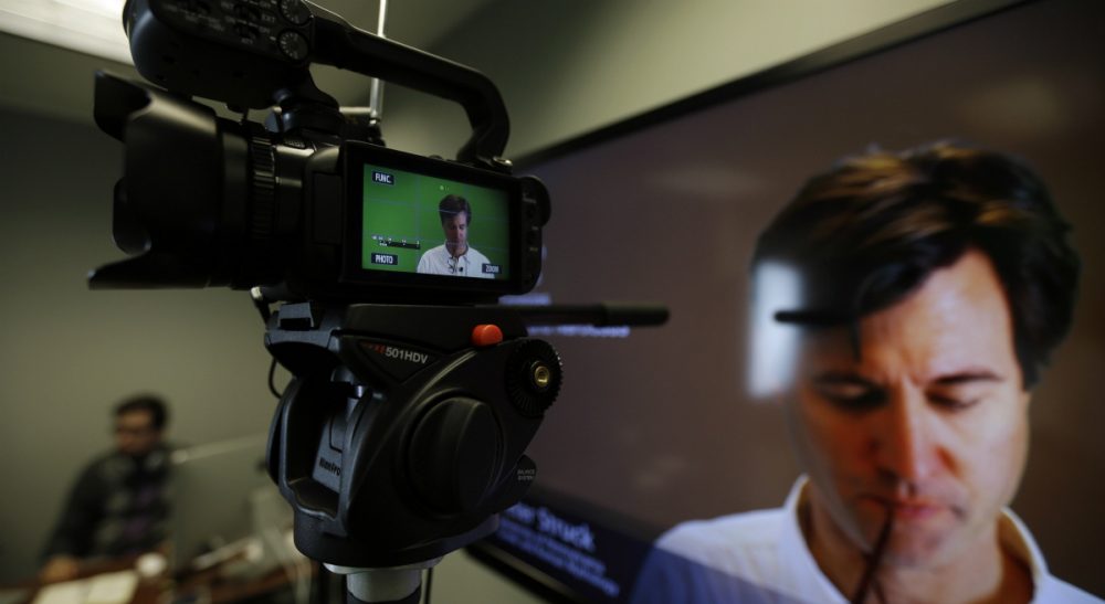 In the best online courses, digital-age technology serves tried-and-true teaching goals, like fostering engagement with and among students. Pictured: Peter Struck, associate professor of Classical Studies at the University of Pennsylvania, prepares to record a lecture on Greek Mythology in Philadelphia. (Matt Slocum/ AP)
