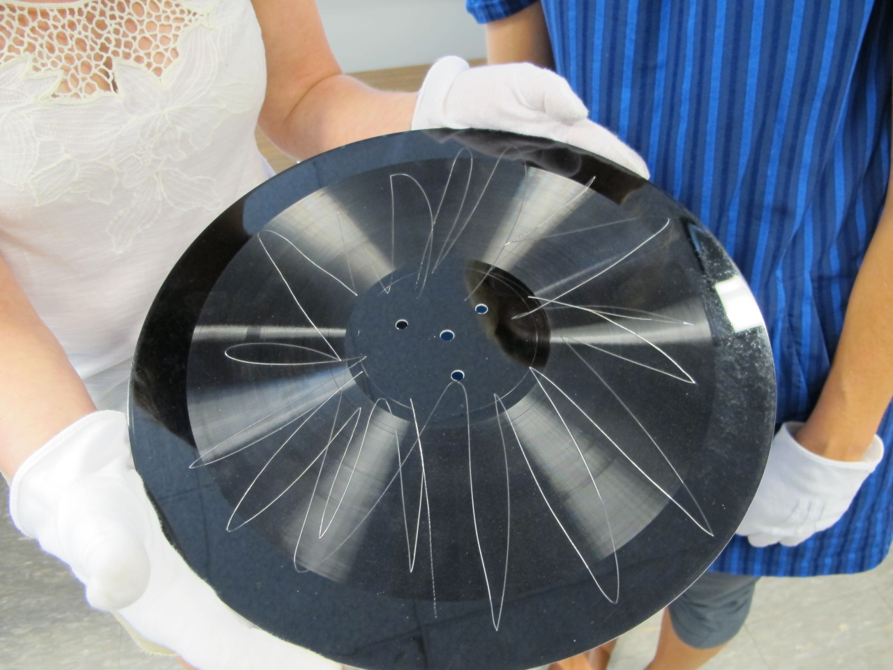 'Not approved by Mr. Frost.' The gouged side of a Robert Frost master recording, unplayable with a stylus, can be heard through IRENE technology. Among the poems on the side not taken is "The Road Not Taken." (Julie Martin/NEDCC)