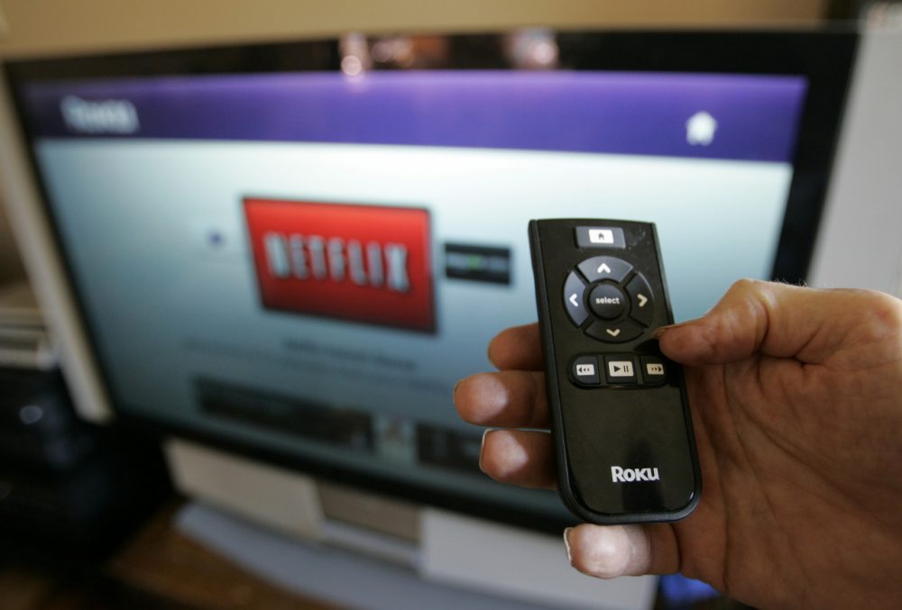 Netflix customer Arthur Michelson demonstrates the online Netflix movie service Roku at his home in Palo Alto, Calif., Thursday, July 23, 2009. (Paul Sakuma/AP)