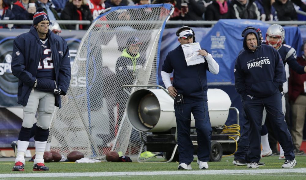 New England Patriots quarterback Tom Brady (12) on the sidelines with offensive coordinator Josh McDaniels, center, and head coach Bill Belichick in the second half. (Charles Krupa/AP)