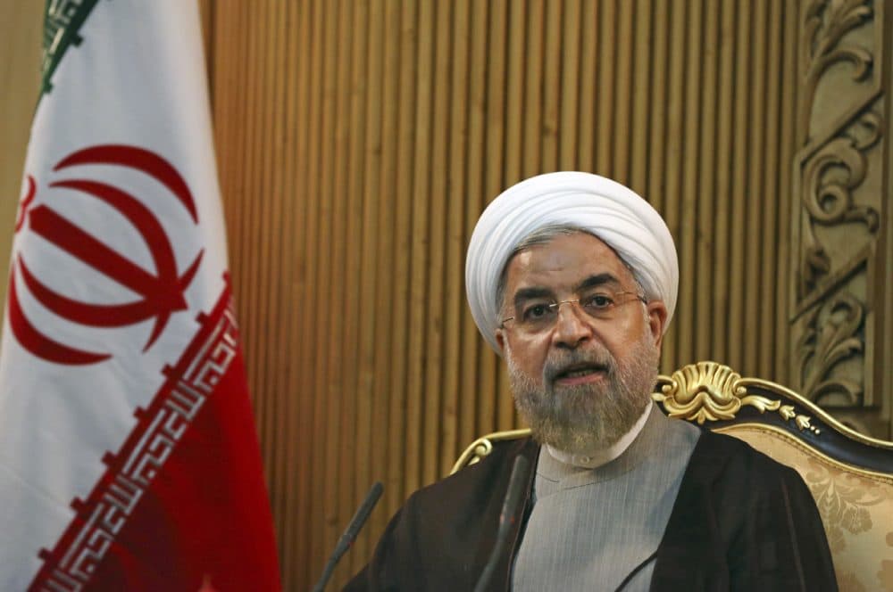In this file photo taken Monday, Sept. 22, 2014, Iranian President Hassan Rouhani briefs media prior to departing Mehrabad airport to attend the United Nations General Assembly, in Tehran, Iran. Rouhani said Sunday, Jan. 4, 2015, that ongoing nuclear negotiations with world powers are a matter of "heart," not just centrifuges ahead of talks next week in Geneva. (Vahid Salemi/AP)