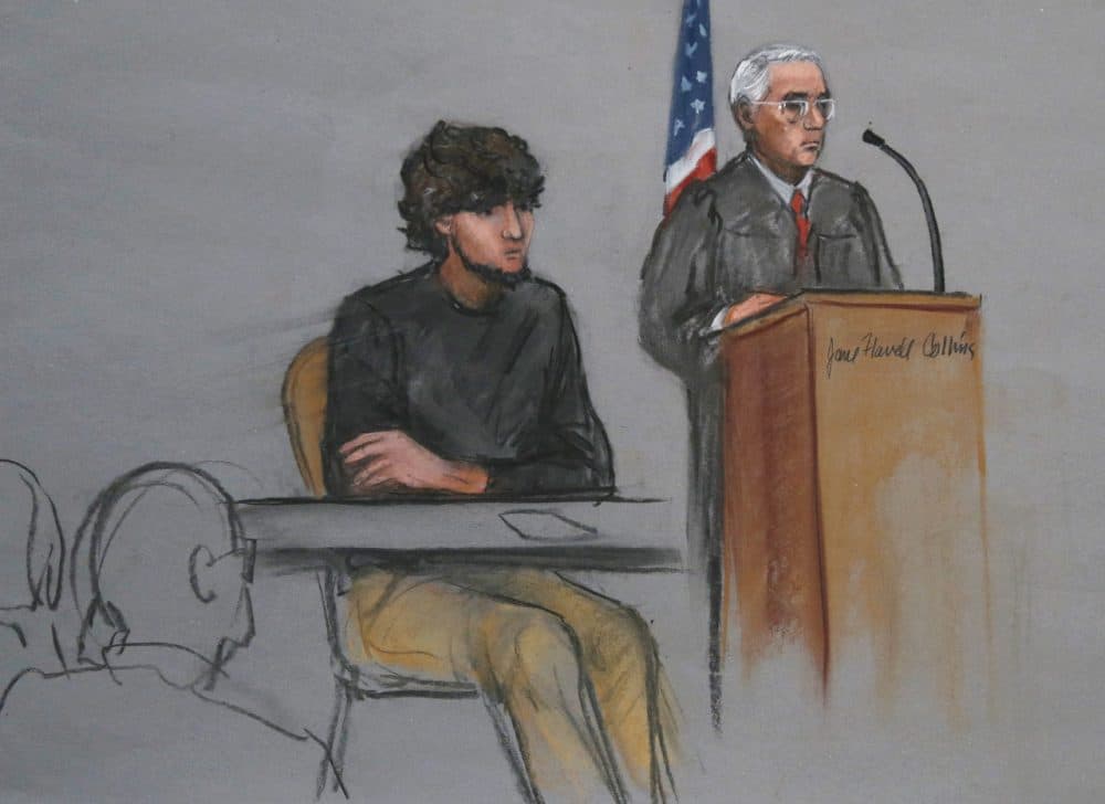 In this courtroom sketch, Boston Marathon bombing suspect Dzhokhar Tsarnaev, left, is depicted beside U.S. District Judge George O'Toole Jr., right, as O'Toole addresses a pool of potential jurors at the federal courthouse in Boston. (Jane Flavell Collins, AP)