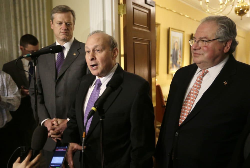 Republican Gov. Charlie Baker, left, Democratic legislative leaders Senate President Stanley Rosenberg, center, and House Speaker Robert DeLeo, right, face reporters during a news conference Monday. (Steven Senne/AP)