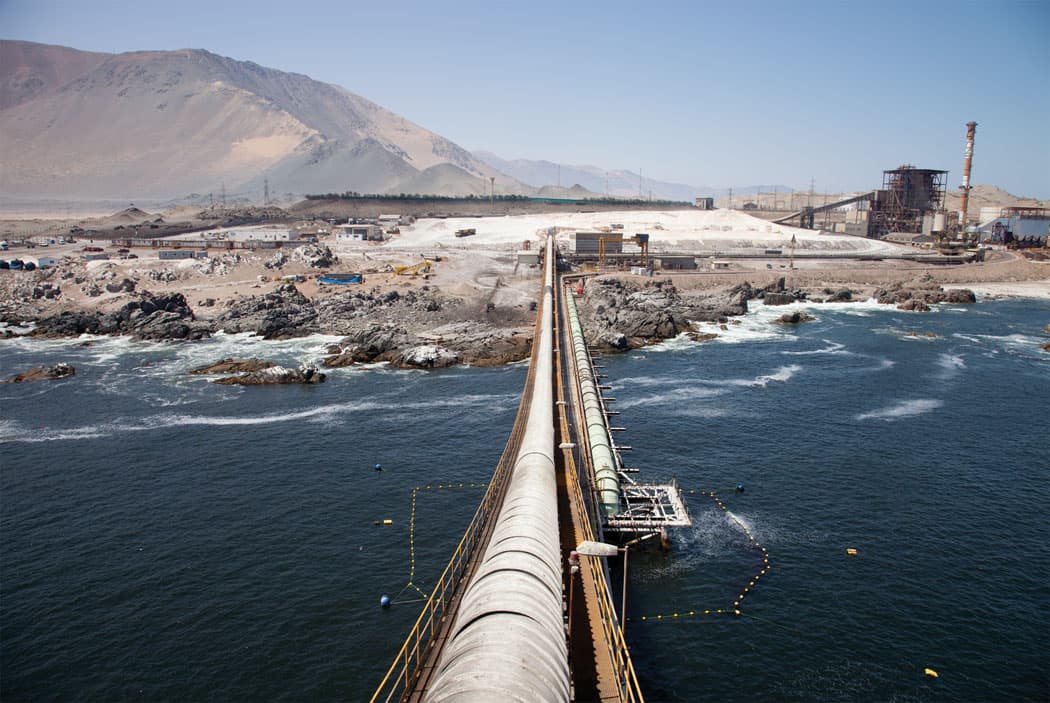 More conveyor belts, this time enclosed in long tubes, carry salt from the Chilean port onto cargo ships. (Allison Cekala)
