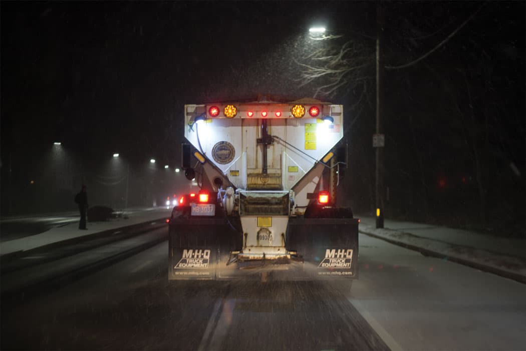 A Boston plow truck salts a street in Dorchester earlier this month. (Allison Cekala)