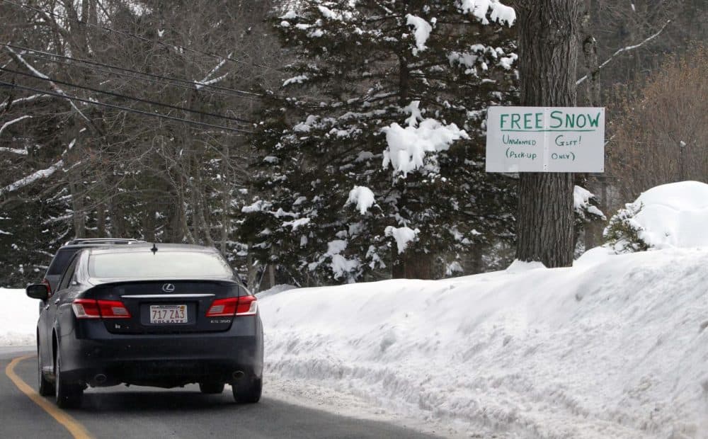 A sign in a Weston resident's front yard offers free snow on Wednesday. Another storm is forecast to bring more snow to the state this weekend. (Bill Sikes/AP)