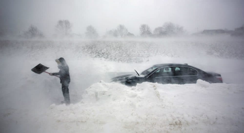 How can we begin to reverse the curse of road-dependency in suburbia, and the snow removal headaches that go with it? (Robert F. Bukaty/AP)