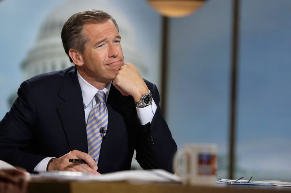 Moderator Brian Williams watches a video which pays tribute to late moderator Tim Russert during a taping of "Meet the Press" at the NBC studios June 22, 2008 in Washington, DC. (Alex Wong/Getty Images for Meet the Press)