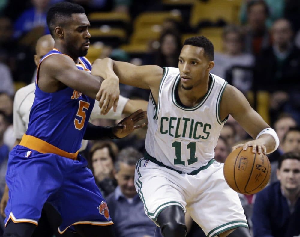 Boston Celtics guard Evan Turner (11) drives against New York Knicks guard Tim Hardaway Jr. (5) during Wednesday night's game in Boston on Feb. 25, 2015. (Elise Amendola/AP)