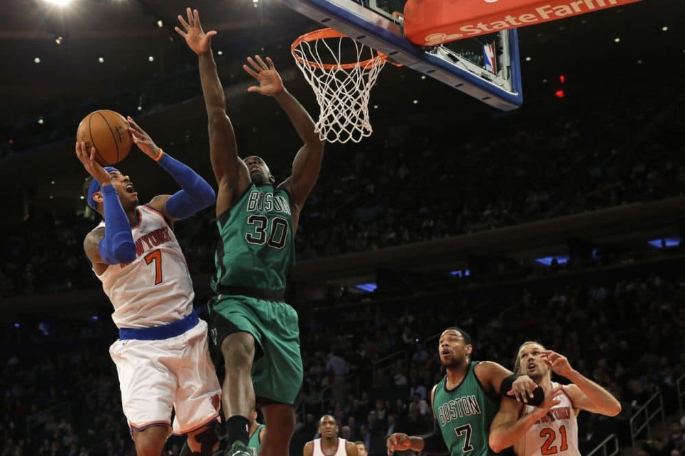 New York Knicks forward Carmelo Anthony (7) goes up against Boston Celtics forward Brandon Bass (30) during Tuesday night's game on Feb. 3, 2015 at Madison Square Garden in New York. (Mary Altaffer/AP)