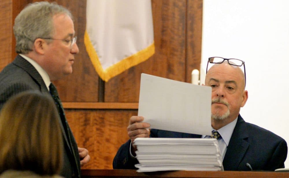 Prosecutor Patrick Bomberg (left) admits cell phone records as evidence to AT&T employee Christopher Ritchell during testimony of the trial of former New England Patriots football player Aaron Hernandez. (Faith Ninivaggi/AP/Pool)