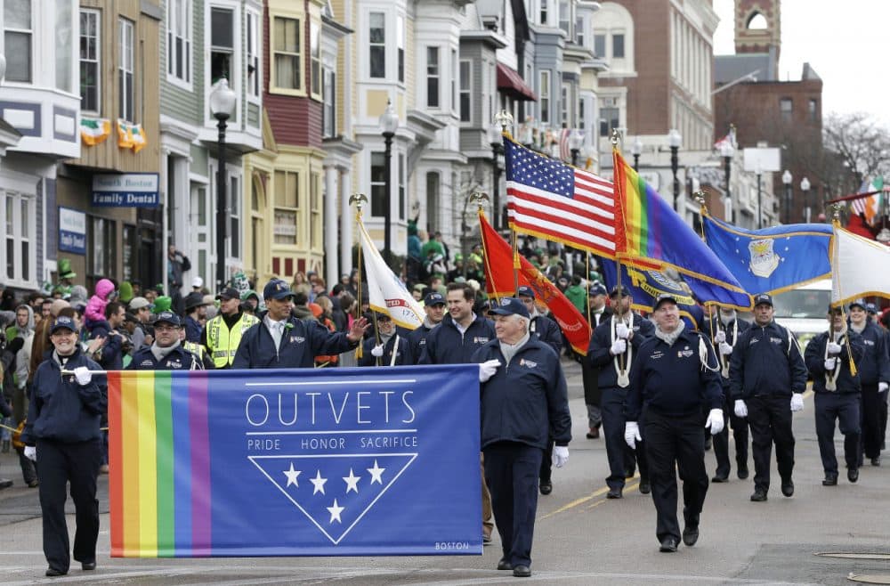 Members of OutVets, a group of gay military veterans, hold a banner and flags as they march in the St. Patrick's Day parade, Sunday in Boston's South Boston neighborhood. (Steven Senne/AP)