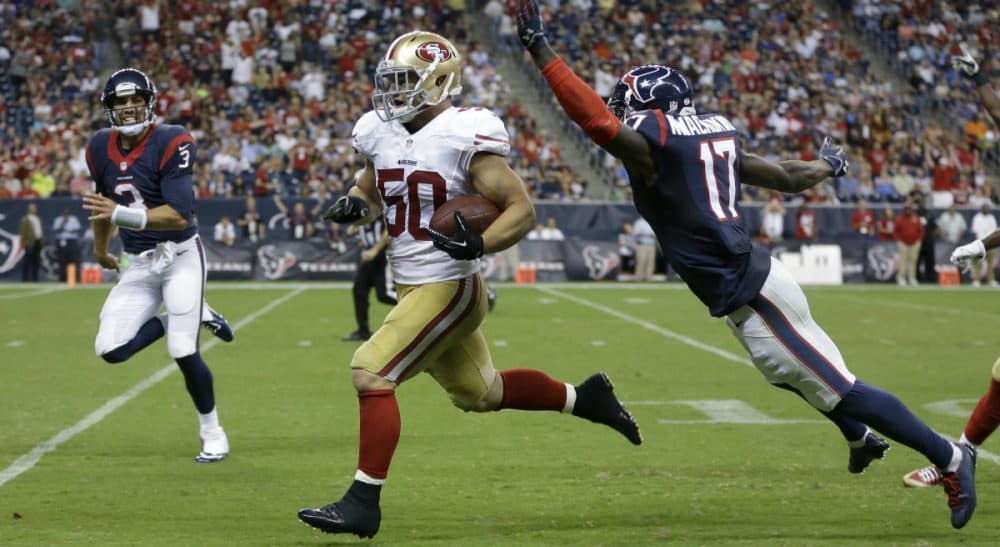 NFL rookie Chris Borland quits after one season, and an actor declines an offer to be the voice of the sport.  Pictured: Borland, playing for the San Francisco 49ers, runs an interception back for a touchdown past Houston Texans' Uzoma Nwachukwu during the third quarter of an NFL football preseason game Thursday, Aug. 28, 2014, in Houston. (Patric Schneider/AP)