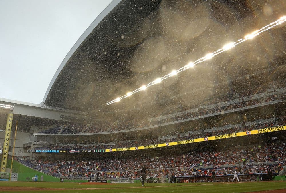 The Miami marlins' retractable roof took 16 minutes to close after an unexpected downpour of rain on Opening Day. (Mike Ehrmann/Getty Images)