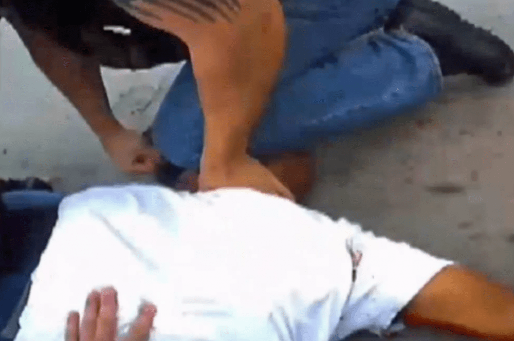 In this frame from the video released by police, Eric Harris is held down after being shot by reserve deputy Robert Bates.