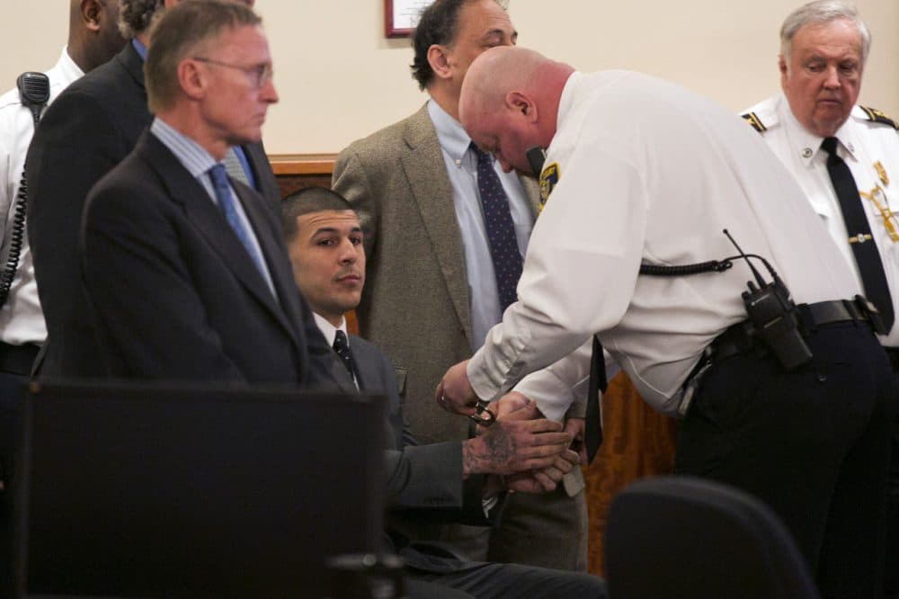 A court officer places handcuffs on the wrists of former New England Patriots football player Aaron Hernandez after the guilty verdict was read during his murder trial at Bristol County Superior Court in Fall River. (Dominick Reuter/AP/Pool)