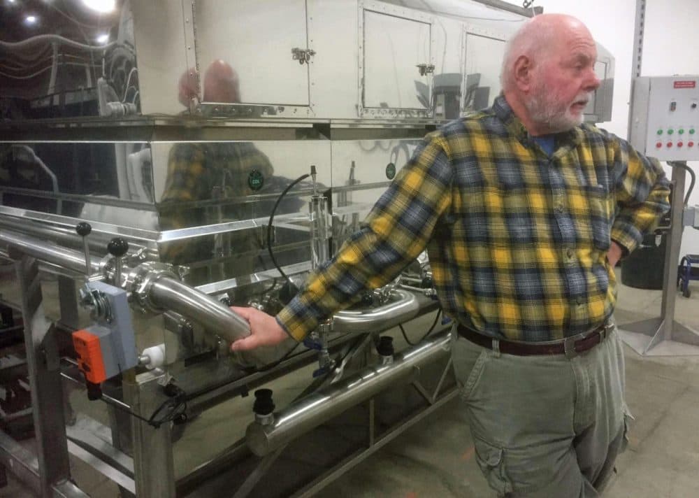 Michael Argyelan, CFO of Sweet Tree Holdings, shows off a maple syrup evaporator at a new processing plant in Island Pond. The out-of-state company is planning to produce value-added maple products that Argyelan says won't compete with local producers. (Charlotte Albright/Vermont Public Radio)
