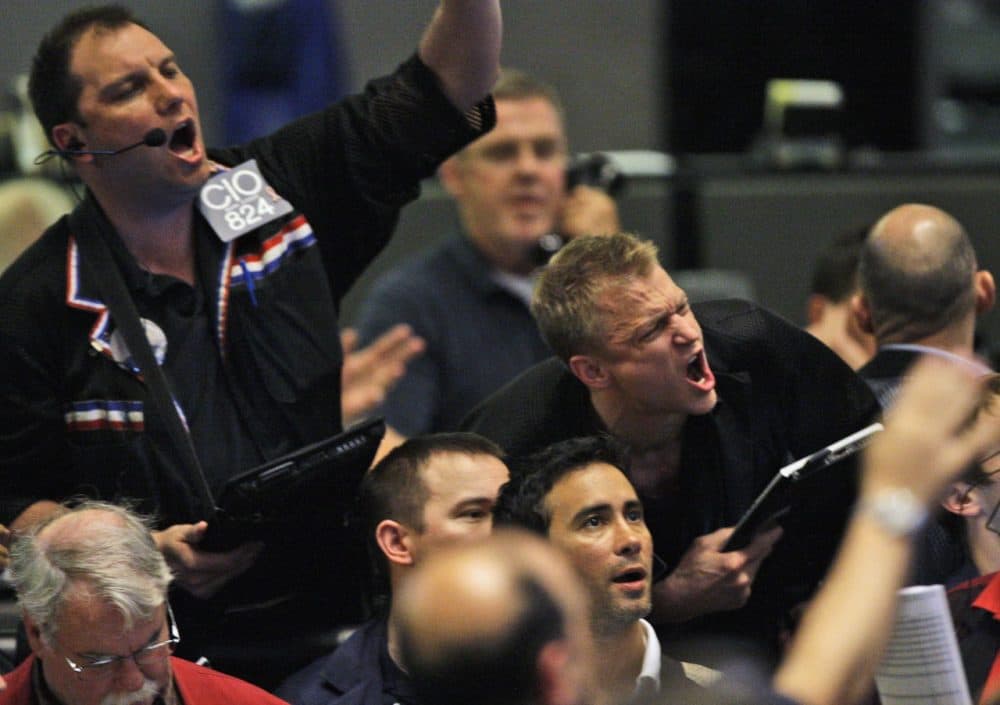 Traders shout orders in the S&P 500 futures pit at the CME Group in Chicago near the close of trading, Thursday, May 6, 2010. The stock market had one of its most turbulent days ever with the Dow Jones industrials plunging nearly 1,000 points in half an hour before recovering two-thirds of its losses. (Kiichiro Sato/AP)