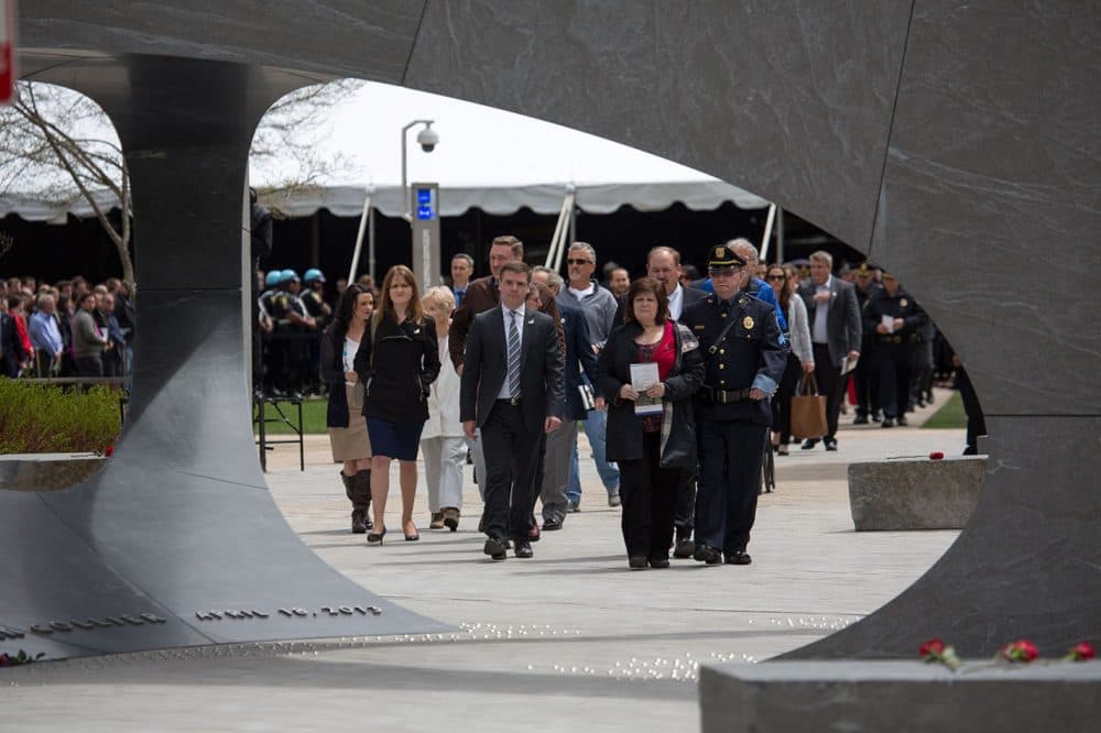 Members of Sean Collier’s family, including his mother Kelley Rogers, approached the memorial Wednesday. (Jesse Costa/WBUR)