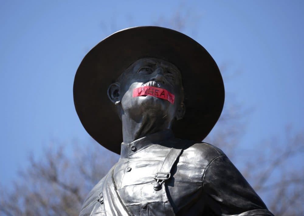 Tape with the word "UNHEARD" covers the mouth of the sculpture "The Sower" at the University of Oklahoma on March 11, 2015 in Norman, Oklahoma. The statue was marked by the black student group OU UNHEARD at the university. (Brett Deering/Getty Images)