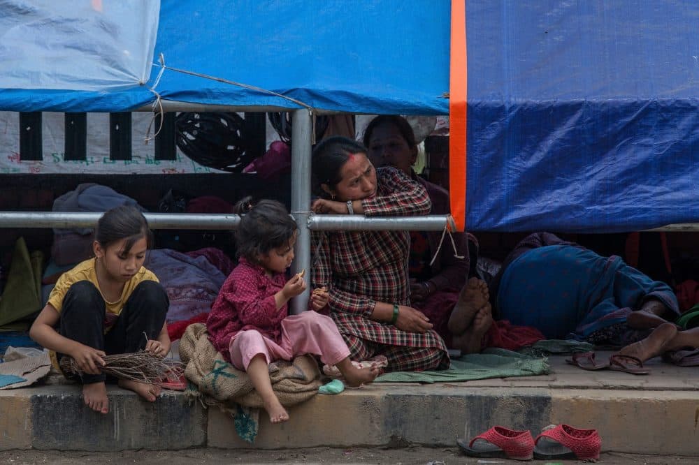 A major 7.8 earthquake hit Kathmandu mid-day on Saturday, and was followed by multiple aftershocks that triggered avalanches on Mt. Everest that buried mountain climbers in their base camps. Many houses, buildings and temples in the capital were destroyed during the earthquake, leaving over 2 thousand dead and many more trapped under the debris as emergency rescue workers attempt to clear debris and find survivors. (Omar Havana/Getty Images)