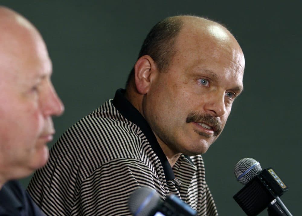 Boston Bruins general manager Peter Chiarelli, right, speaks alongside head coach Claude Julien at a news conference at TD Garden Monday. (Bill Sikes/AP)