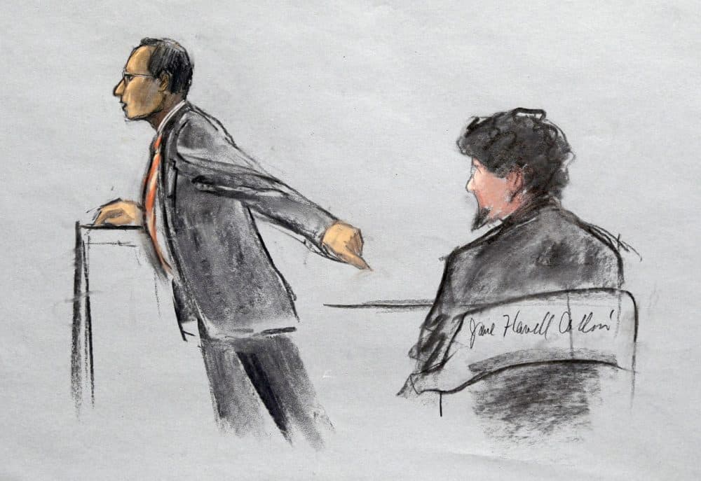 In this courtroom sketch, Assistant U.S. Attorney Aloke Chakravarty points to defendant Dzhokhar Tsarnaev, right, during closing arguments in Tsarnaev's federal death penalty trial Monday. (Jane Flavell Collins/AP)