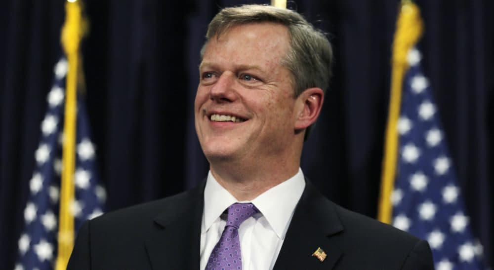 Mary Battenfeld: "Budgets contain more than numbers. They tell the story of who we are and what we care about. Right now, the story features inadequate funding for 200,000 Massachusetts children who live in poverty. " Pictured: Gov. Charlie Baker smiles as he unveils his 2016 budget proposal during a news conference at the State House in Boston, March 4, 2015. (Charles Krupa/AP)