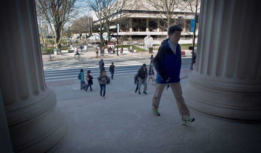 Student climb the steps of the Rogers building at MIT. (Robin Lubbock/WBUR)