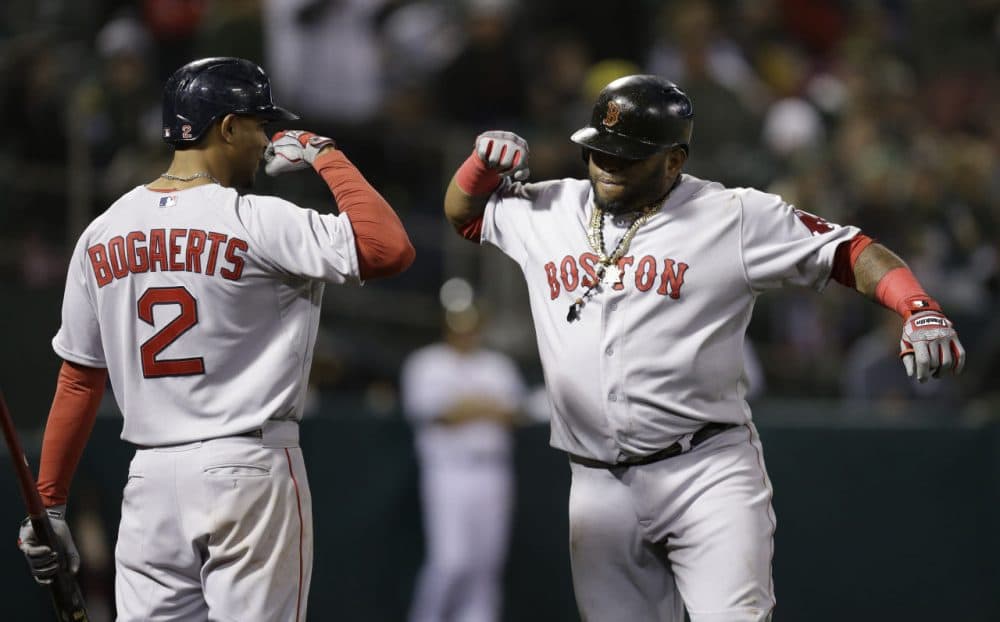 Boston Red Sox Pablo Sandoval, right, celebrates with Xander Bogaerts after Sandoval hit a home run in the eleventh inning on May 11, 2015. (Ben Margot/AP)