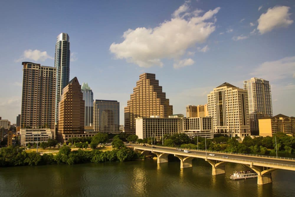 The sun sets on the Austin skyline and Congress Street Bridge. (Stuart Seeger/Flickr Creative Commons)