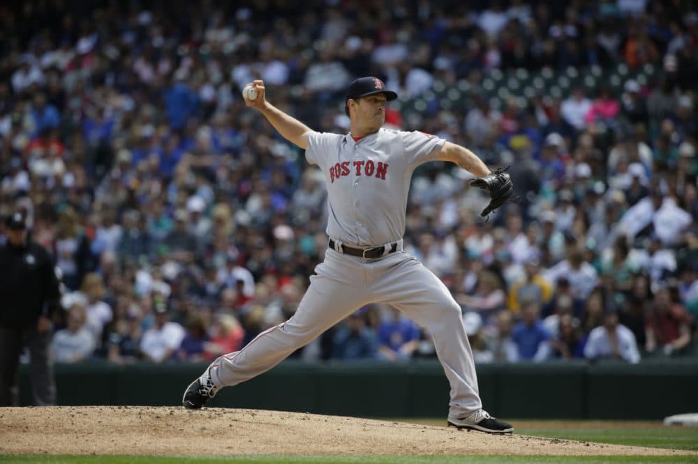 Starting pitcher Steven Wright throws against the Seattle Mariners in a baseball game, Sunday, May 17, 2015, in Seattle.