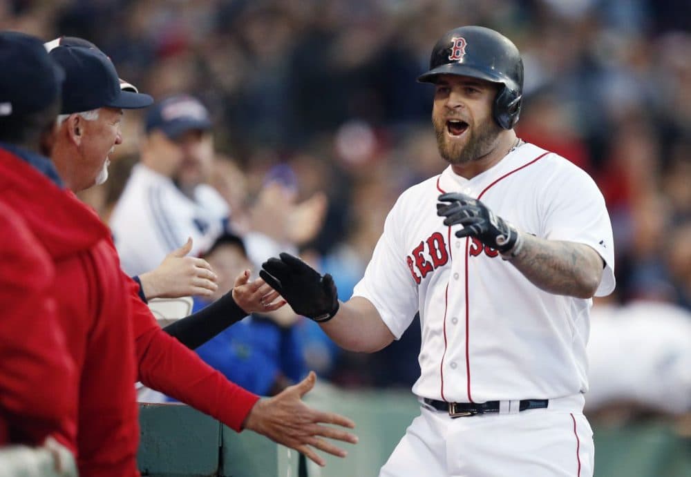 Red Sox's Mike Napoli, right, celebrates his solo home run during the second inning against the Los Angeles Angels in Boston, Saturday, May 23, 2015. (AP Photo/Michael Dwyer)