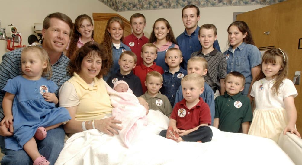 In this photo, the Duggar family, stars of the hit reality TV show "19 Kids and Counting," is pictured after the birth of their 17th child, 2007. Last week, the Duggar's eldest son Josh confirmed reports that, as a teenager, he molested several underage girls, including his sisters. (Beth Hall/AP)
