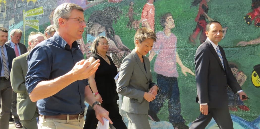 Harry Smith of the Fairmount Cultural Corridor initiative leads National Endowment for the Arts chairman Jane Chu on a tour of Uphams Corner. Janes Canales is beside her and San San Wong, both of the Barr Foundation, is behind them. Paul Grogan of the Boston Foundation is in the rear. (Kristen Hagan/NEA)