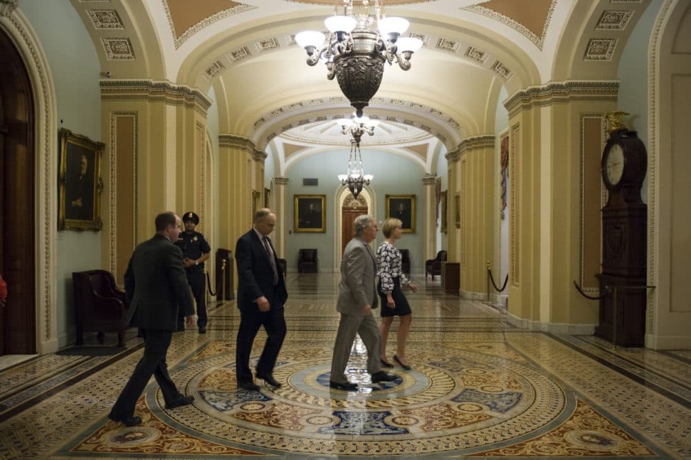 Senate Majority Leader Mitch McConnell, R-Ky., leaves the Senate Chamber after offering amendments to the USA Freedom act during a special session to extend surveillance programs on Sunday. (Cliff Owen/AP)