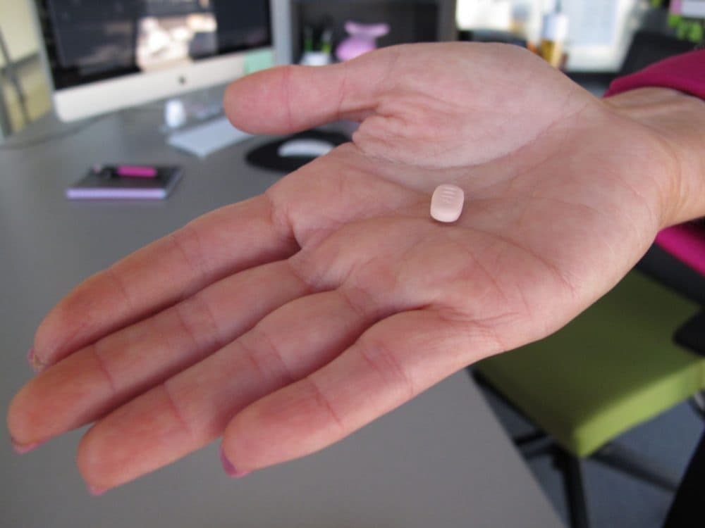 In this Friday, Sept. 27, 2013, photo, Cindy Whitehead holds a tablet of flibanserin in her office at Sprout Pharmaceuticals in Raleigh, N.C. (Allen G. Breed/AP)