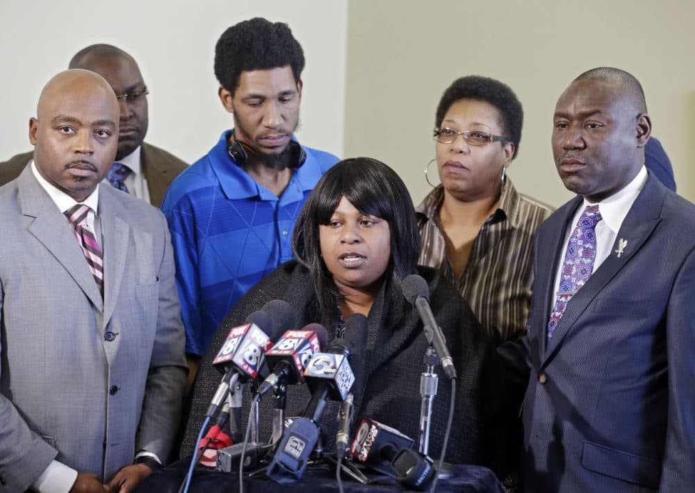 Samaria Rice, center, speaks about the investigation into the death of her son Tamir Rice, at a news conference with attorneys Walter Madison, left, and Benjamin Crump in Cleveland on Jan. 6, 2015. (Mark Duncan/AP)