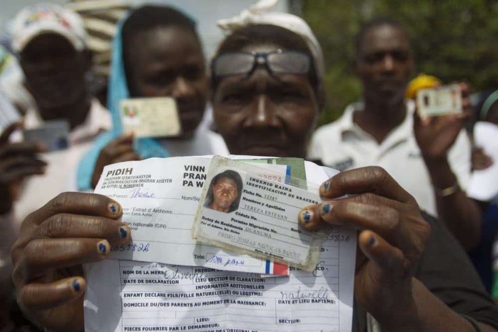 Haitian sugar cane workers rally in front of the Haitian embassy demanding the Haitian passports needed to regularize their migration status in the Dominican Republic, in Santo Domingo on June 1, 2015. (Erika Santelices/AFP/Getty Images)