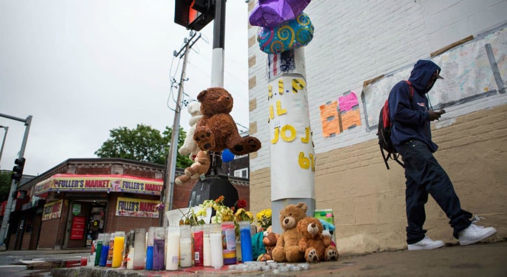 Mark Culliton: "Jobs programs for youth are important and powerful, but if we don’t target the dropouts who exert a pull of their own, we won't stem the problem of youth violence in summer." Pictured: A pop up memorial for Jonathan Dos Santos on the corner of Washington and Fuller streets in Dorchester, Mass., where the 16-year-old was shot and killed on June 10, 2015. (Jesse Costa/WBUR)